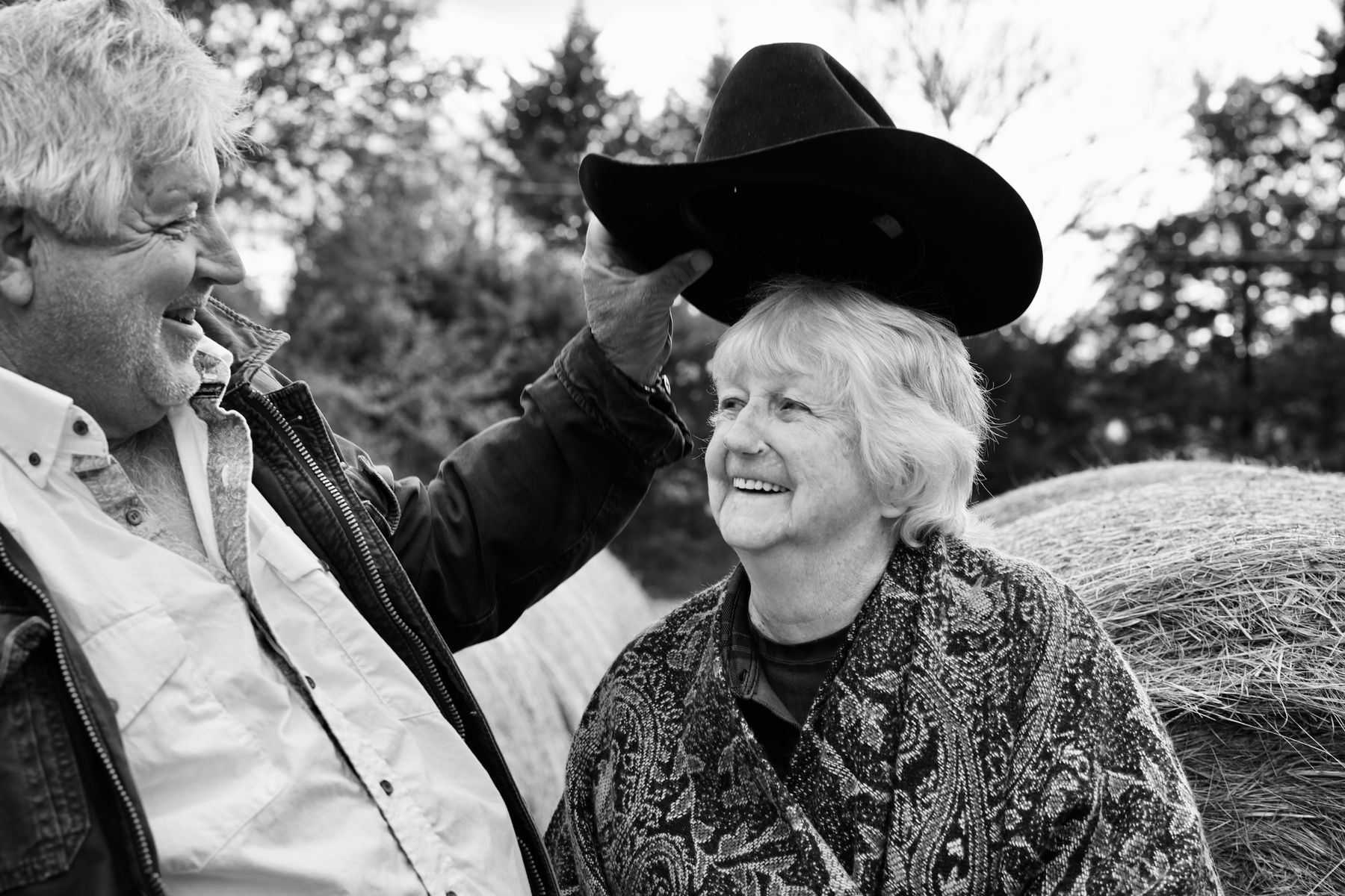 Greg Puts Cowboy Hat on His Laughing Mother